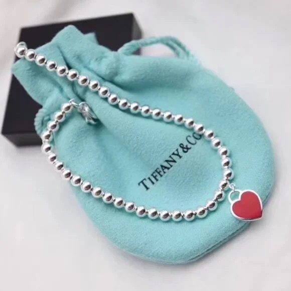 Tiffany &  Co. Jewelry - Tiffany & Co. Silver Bracelet with Red Heart Charm